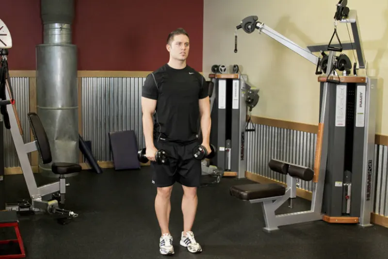 Почергові підйоми гантелей перед собою та в сторони — техніка виконання