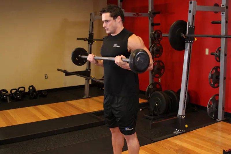 Підйом штанги на біцепс уздовж тулуба (дрег-керл): кінцеве положення